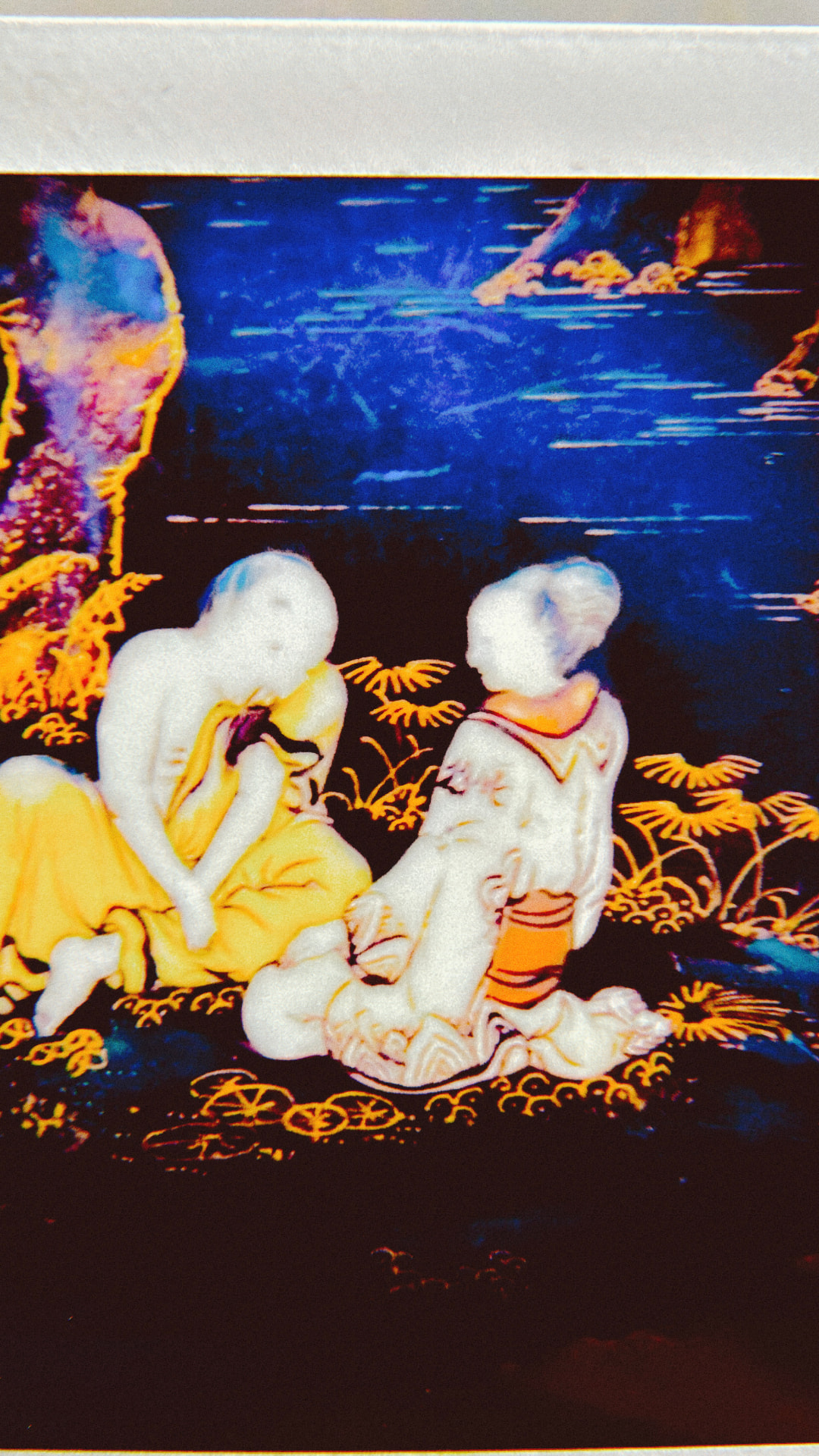 NAUGHTY DREAM artwork — two porcelain figures in a glowing blue and gold landscape
